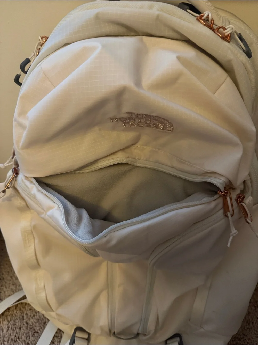The North Face Surge Lux Backpack in Cream with Rose Gold(good as new 90%)